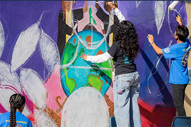 https://www.kindnessinmotionmag.com/wp-content/uploads/2025/03/mlk-service-painting-2020.jpg