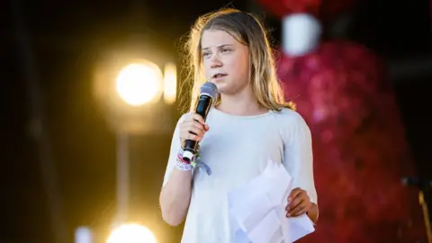 Getty Images Greta Thunberg speaks at the Glastonbury Festival, 2023