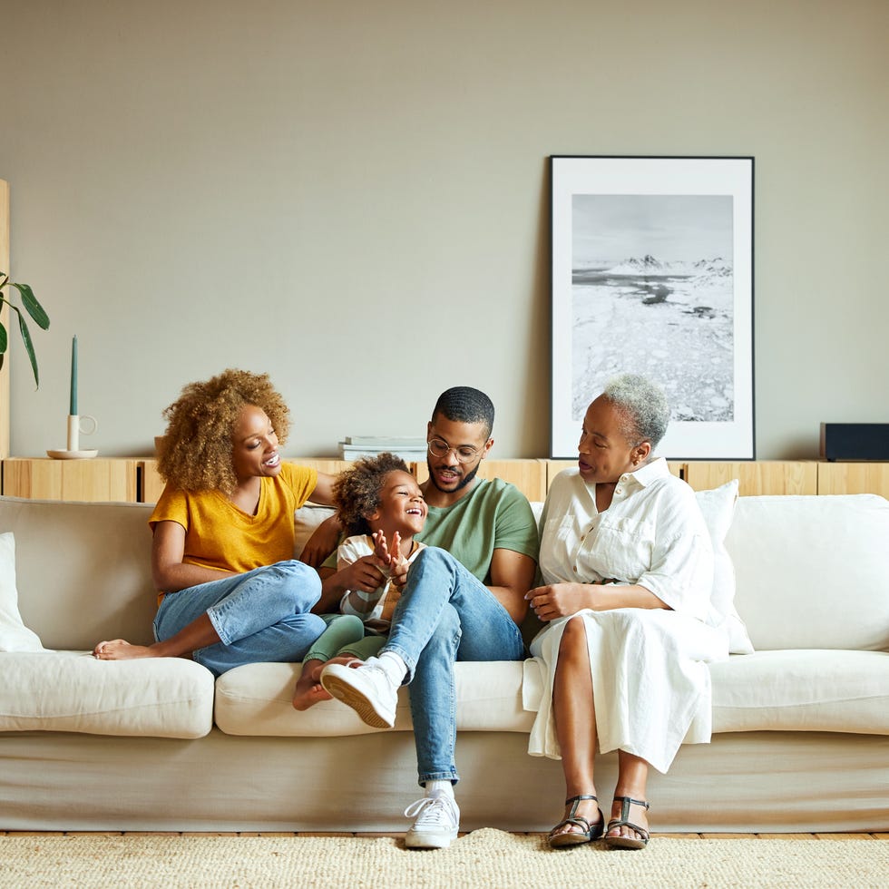 a family sitting on a couch together