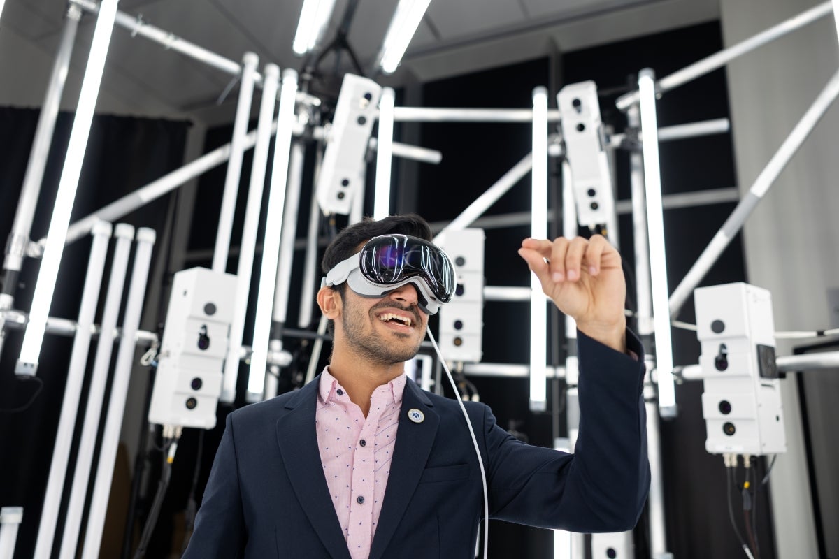 A person interacts with a VR headset